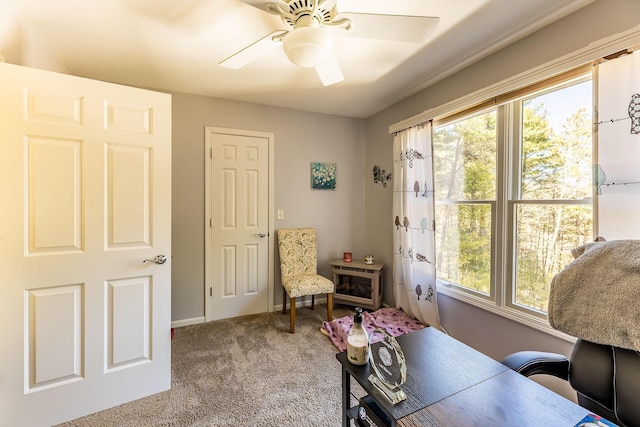 office area with baseboards, carpet, and ceiling fan