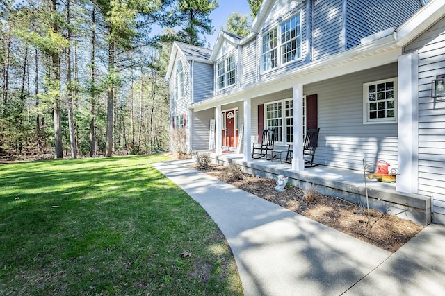 exterior space with a lawn and covered porch