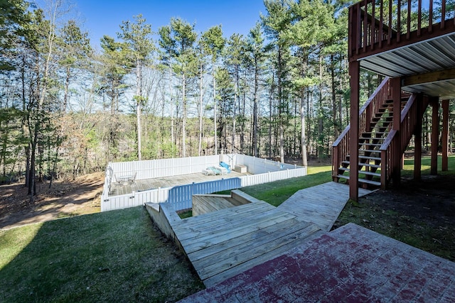 exterior space featuring a lawn and stairs