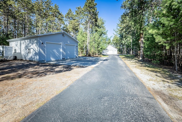 view of road featuring aphalt driveway