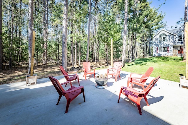 view of patio with an outdoor fire pit