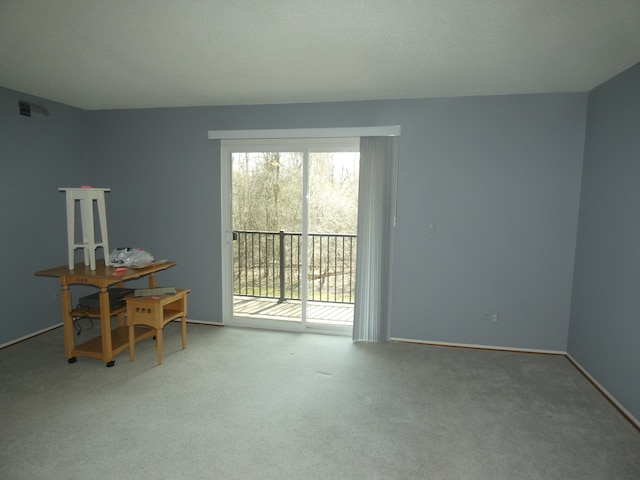 interior space with baseboards and carpet flooring