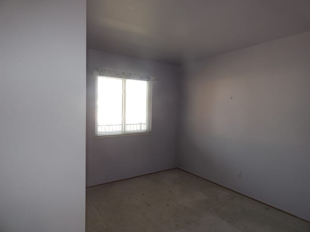 empty room with light colored carpet