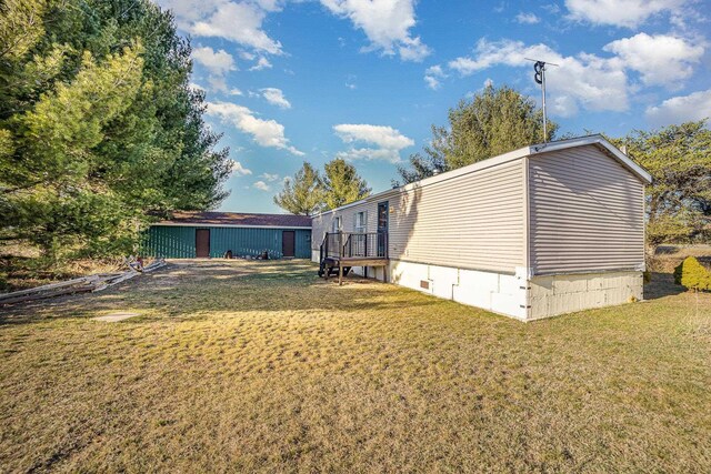 10269 30th Ave, Evart, MI 49631 - view of property exterior featuring a yard and a deck