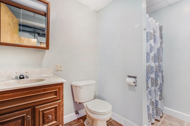 full bathroom featuring vanity, toilet, baseboards, and tile patterned floors