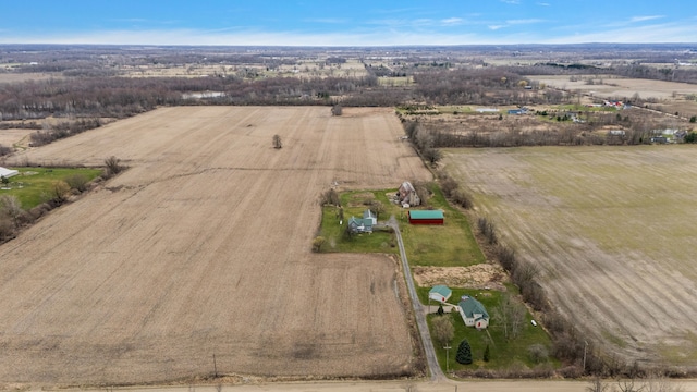 birds eye view of property featuring a rural view