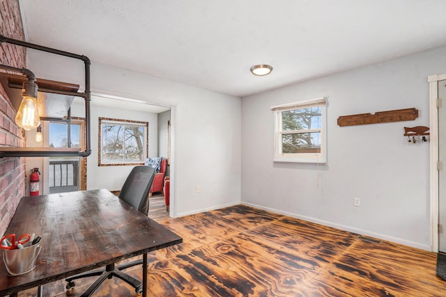 office area with wood finished floors and baseboards
