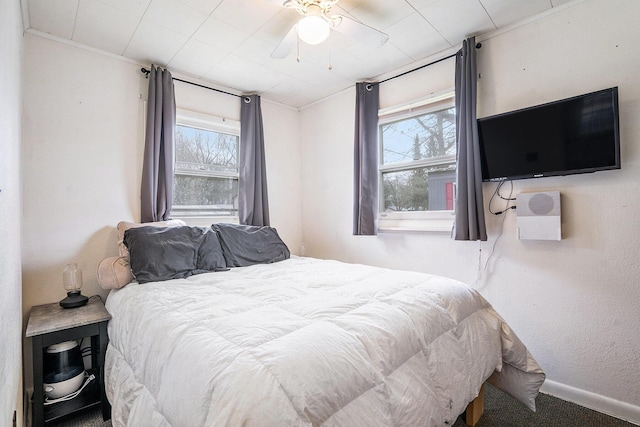 bedroom featuring baseboards and carpet flooring