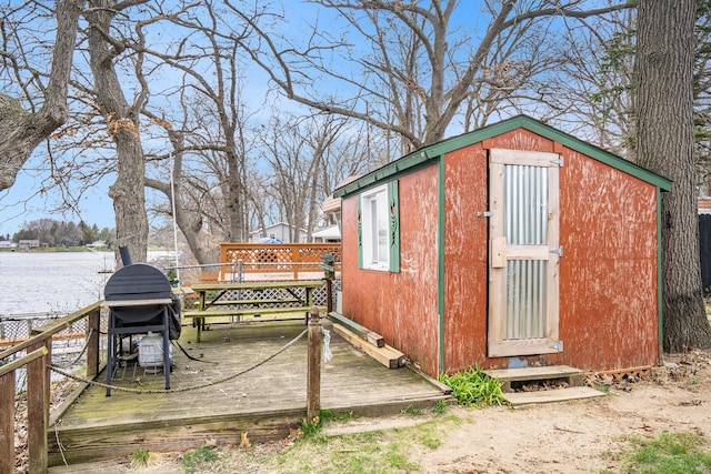 view of shed with a water view