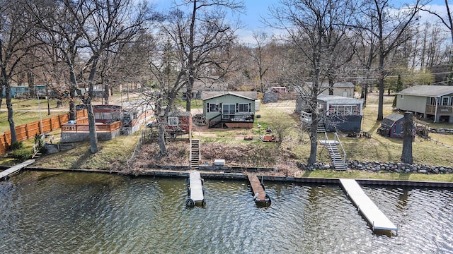 view of dock featuring a deck with water view and stairs