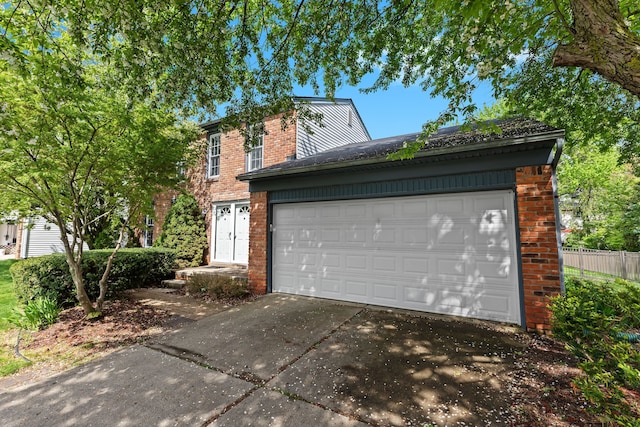 garage featuring driveway