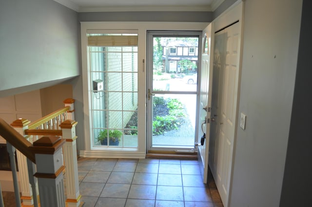 3629 Frederick Dr, Ann Arbor, MI 48105 - doorway to outside with ornamental molding and light tile patterned floors
