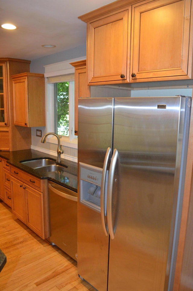 3629 Frederick Dr, Ann Arbor, MI 48105 - kitchen featuring stainless steel appliances, light wood-type flooring, dark stone counters, recessed lighting, and brown cabinets
