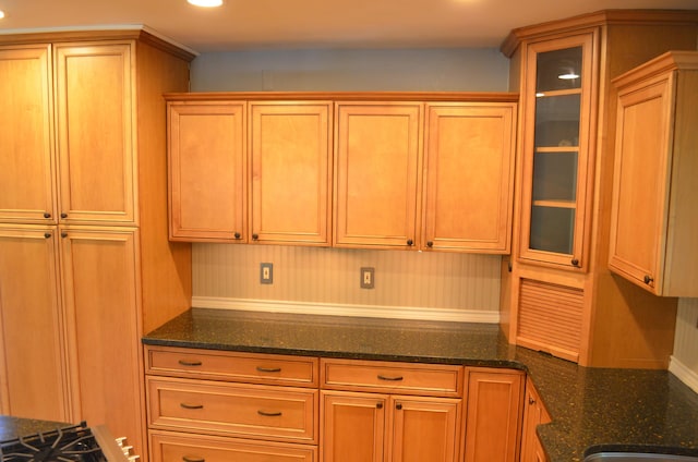 3629 Frederick Dr, Ann Arbor, MI 48105 - kitchen featuring glass insert cabinets, recessed lighting, and dark stone countertops