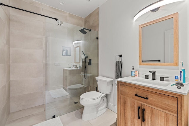 full bathroom featuring tile patterned flooring, walk in shower, toilet, and vanity