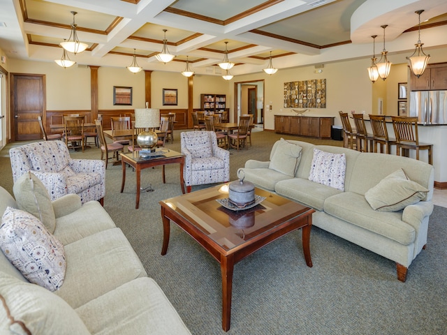 living area featuring crown molding, carpet floors, coffered ceiling, and beam ceiling