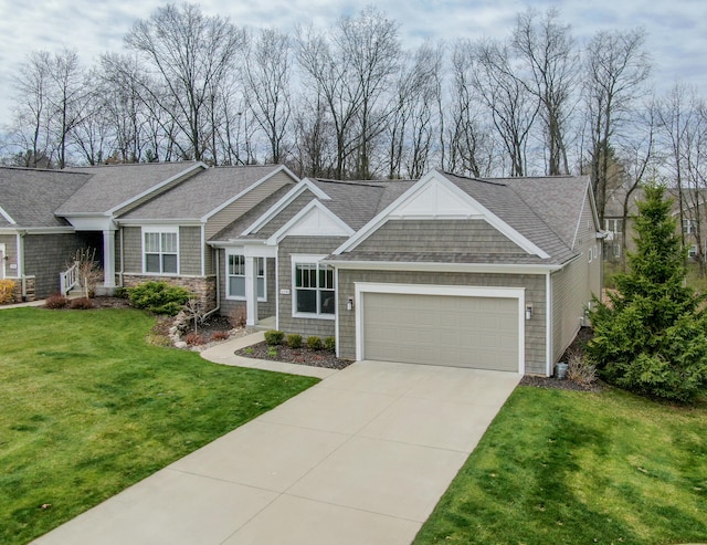 craftsman house featuring a garage, a shingled roof, a front yard, and concrete driveway