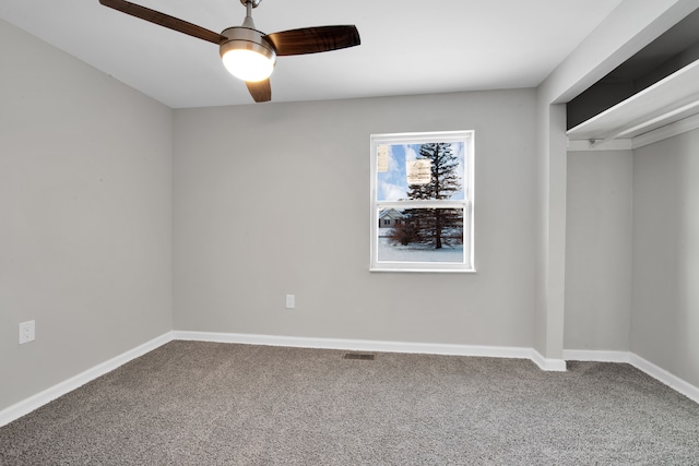 unfurnished bedroom featuring ceiling fan, baseboards, carpet flooring, and visible vents