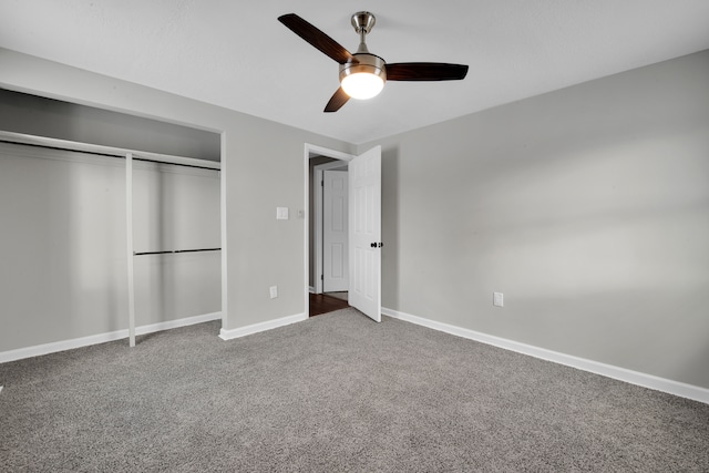 unfurnished bedroom with a ceiling fan, baseboards, carpet, and a closet