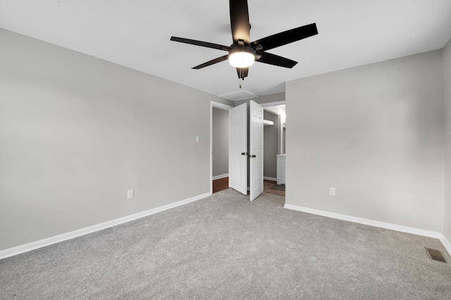 unfurnished bedroom featuring carpet, visible vents, and baseboards