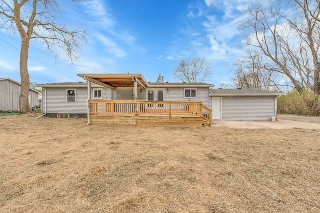 rear view of property featuring a wooden deck and french doors