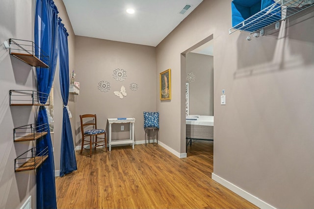 spacious closet with wood finished floors and visible vents