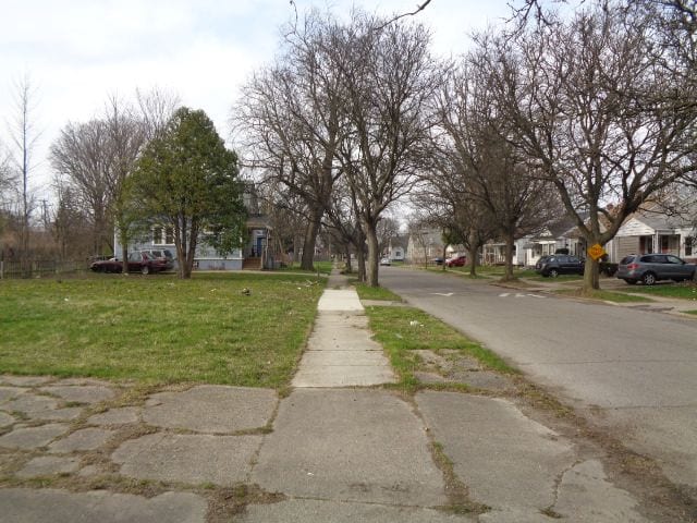 view of road featuring a residential view and sidewalks