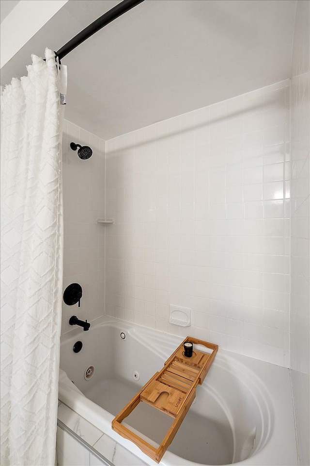 full bath featuring a combined bath / shower with jetted tub
