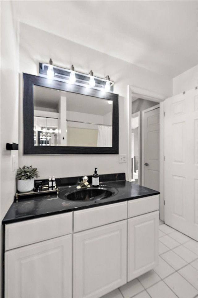 bathroom featuring vanity and tile patterned flooring
