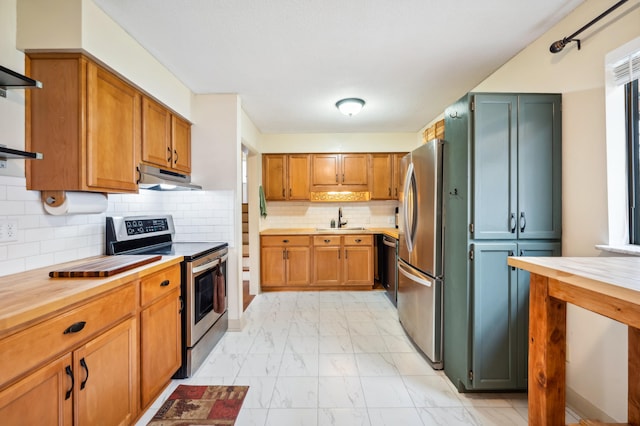 1843 N Sierra Way, Stevensville, MI 49127 - kitchen with a sink, marble finish floor, butcher block counters, stainless steel appliances, and under cabinet range hood