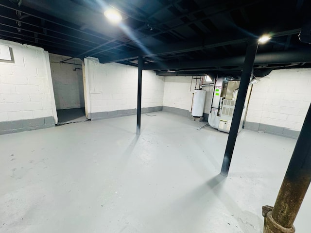 unfinished basement featuring water heater and heating unit