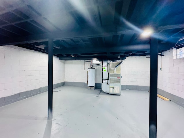 basement featuring gas water heater and heating unit
