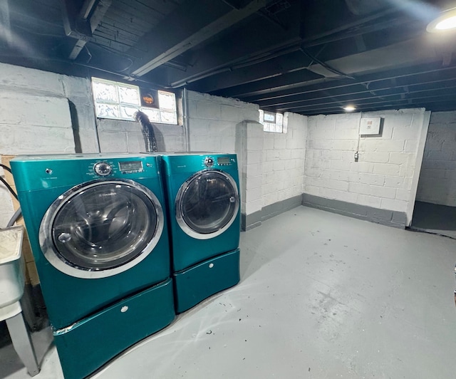 below grade area featuring washer and dryer
