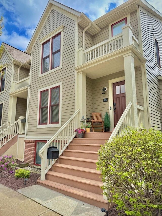 906 Blodgett St SE, Grand Rapids, MI 49506 - multi unit property with a balcony, covered porch, and stairway