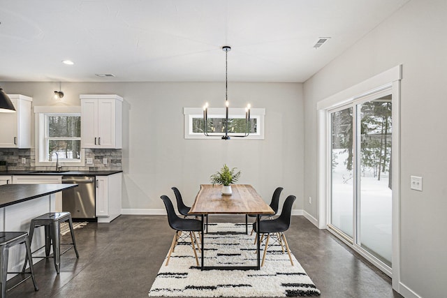 dining area with concrete floors, baseboards, a notable chandelier, visible vents, and recessed lighting