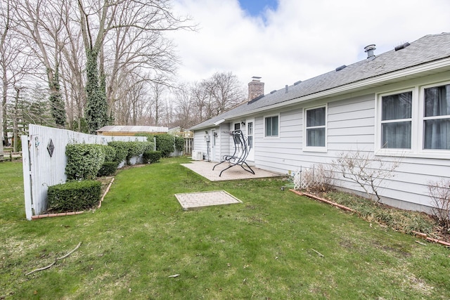 view of yard featuring a patio and fence