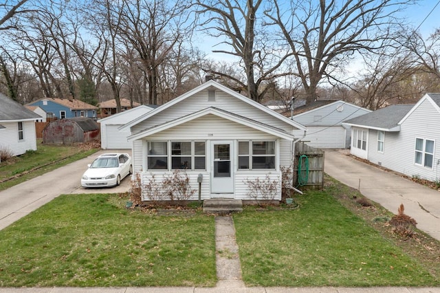 bungalow-style house with a front yard