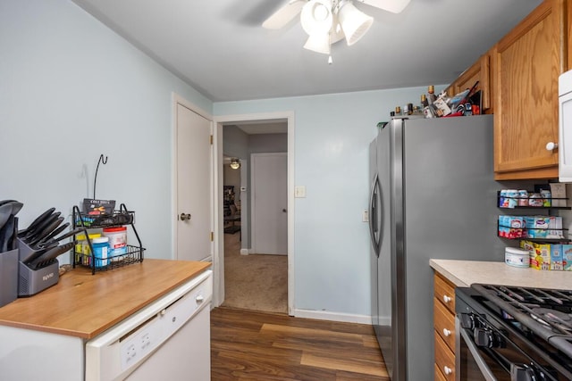 kitchen with light countertops, a ceiling fan, and dark wood-style floors