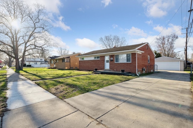 35333 Stellwagen St, Wayne, MI 48184 - ranch-style home with a front lawn, an outdoor structure, brick siding, and a garage