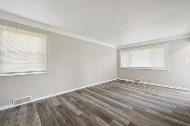 35333 Stellwagen St, Wayne, MI 48184 - spare room with wood finished floors, visible vents, and baseboards