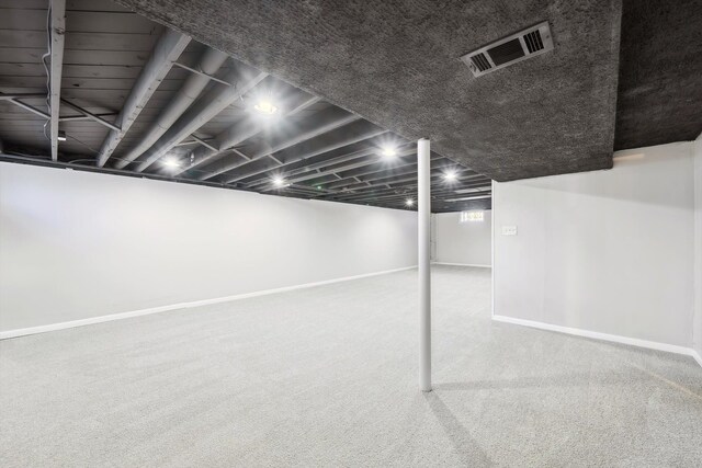 35333 Stellwagen St, Wayne, MI 48184 - finished basement featuring baseboards, visible vents, and carpet