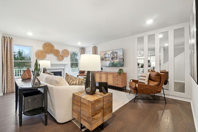 14331 Old Oak Trl, Van Buren, MI 48111 - living area featuring recessed lighting, a healthy amount of sunlight, a high end fireplace, and dark wood-type flooring