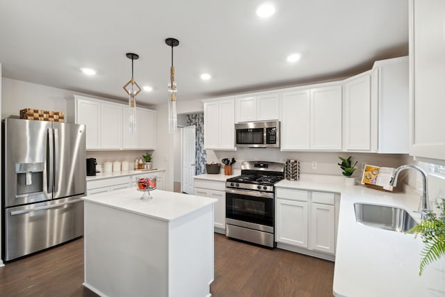 14331 Old Oak Trl, Van Buren, MI 48111 - kitchen featuring appliances with stainless steel finishes, a sink, light countertops, dark wood finished floors, and white cabinetry