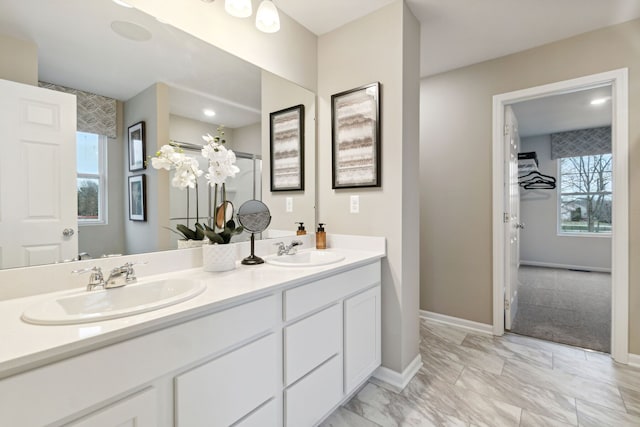 14331 Old Oak Trl, Van Buren, MI 48111 - bathroom featuring double vanity, a wealth of natural light, and a sink