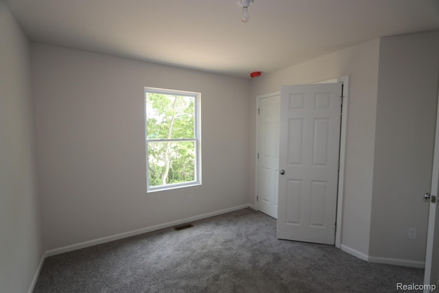 14331 Old Oak Trl, Van Buren, MI 48111 - unfurnished bedroom with carpet flooring and baseboards