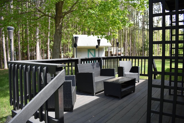 7885 W Fox Rd, Mears, MI 49436 - wooden terrace with an outdoor living space