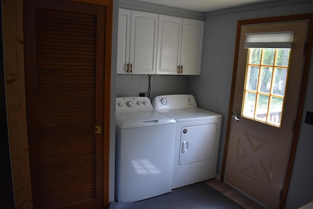 7885 W Fox Rd, Mears, MI 49436 - washroom with washer and clothes dryer and cabinet space