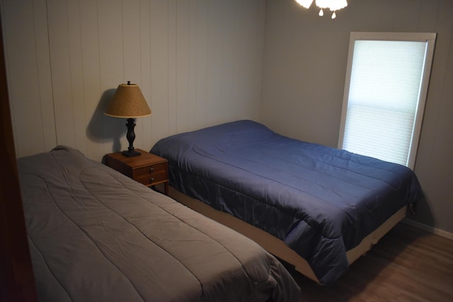 7885 W Fox Rd, Mears, MI 49436 - bedroom featuring wood finished floors and baseboards