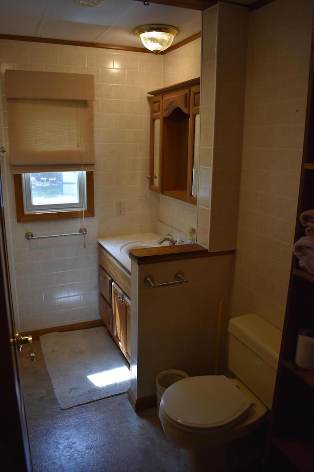 7885 W Fox Rd, Mears, MI 49436 - bathroom with toilet, vanity, tile walls, and concrete flooring