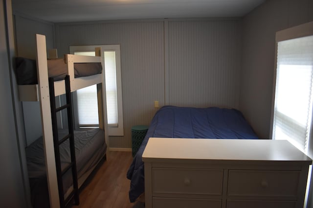 7885 W Fox Rd, Mears, MI 49436 - bedroom with wood finished floors and multiple windows